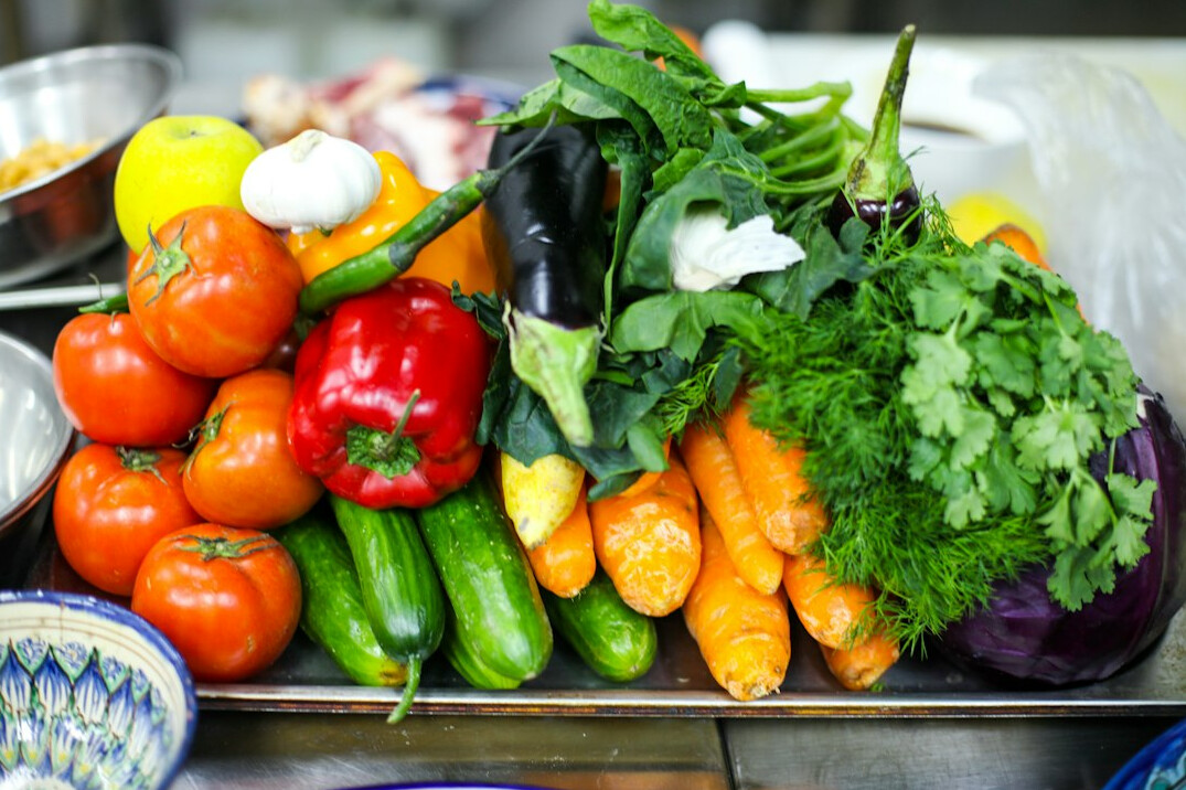 Fresh colorful vegetables and healthy ingredients on a table