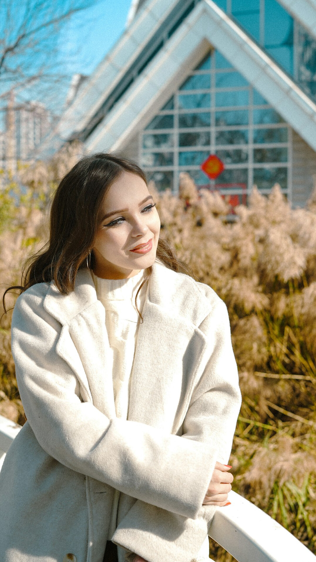Smiling female health mentor in a white coat